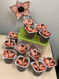 there are many small cups with strawberries in them on the table next to each other