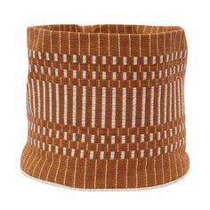 a brown and white striped basket on a white background