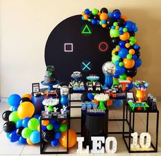 an image of a party setting with balloons and games on the wall in the background