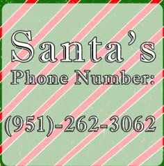 the santa's phone number sign is green with red and white stripes on it