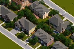 an aerial view of several houses in a residential area with trees and bushes around them