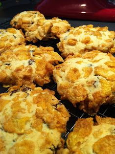 some biscuits are cooling on a rack in the kitchen and ready to be eaten by someone