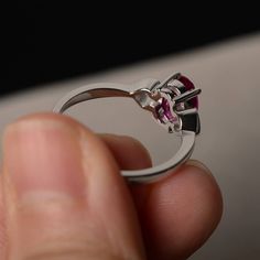 This is a gorgeous handmade creation. Its beauty is its simplicity & Elegance. The 6*8mm oval shape faceted lab ruby is crafted in solid sterling silver and with rhodium plated. All item is sent in a beautiful gift box If you have any idea of design your ring,pls contact me directly. You can realize more lovely stuff clicking the link https://www.etsy.com/shop/knightjewelry?refshopsection_shophome_leftnav Please leave the correct address and you phone number for delivering successfully. Oval Ruby Ring With Center Stone In Sterling Silver, Marquise Cut Ruby Ring For Promise, Oval Ruby Birthstone Ring With Accent Stones, Oval Lab-created Ruby Birthstone Ring With Center Stone, Oval Lab-created Ruby Birthstone Ring, Sterling Silver Oval Rings For Valentine's Day, Gift Marquise Cut Ruby Ring With Prong Setting, Oval Ruby Ring With Prong Setting For Proposal, Oval Ruby Solitaire Ring