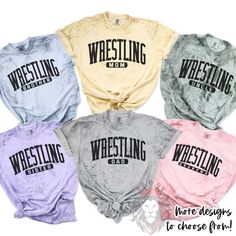 four different colored shirts with the words wrestling in black and white, one is for women