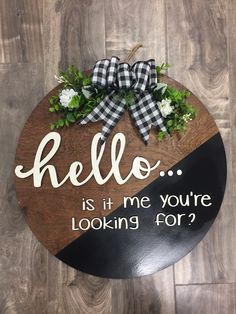 a wooden sign that says, hello is it me you're looking for?