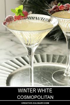 two martinis with raspberries on the rim and text winter white cosmopolian