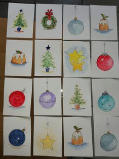 twelve christmas cards with watercolor ornaments on them