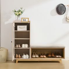 a shelf filled with shoes next to a wall mounted clock