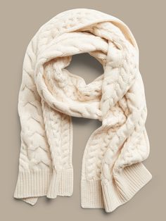 A signature staghorn cable-knit stitch flanked by rows of smaller cable-stitches adorn this cozy cashmere scarf.  Length: 77" (195. 6cm) Width: 13" (33cm) Blue Plaid Scarf, Winter Knit Scarf, Houndstooth Scarf, Scarf Trends, Cable Knit Scarf, Snood Scarf, Cashmere Hat, Chunky Scarves, Leopard Print Scarf