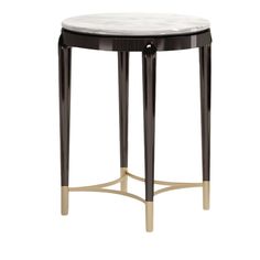 a black and white marble top side table with gold accents on the legs, against a white background