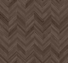 an image of wood flooring that looks like chevroned herringbones in brown