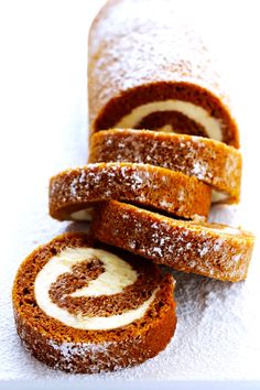 several pieces of bread with cream filling on them