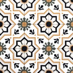 an artistic tile design with black and orange accents