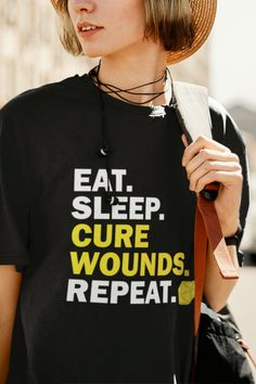 a woman wearing a black shirt with words on it