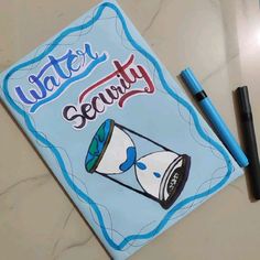 a notebook with the words water security written on it next to a marker and pen