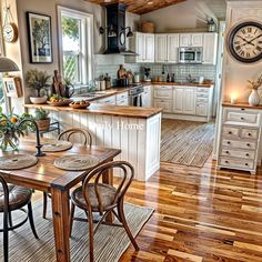 a large kitchen with wooden floors and white cabinetry, along with a breakfast nook