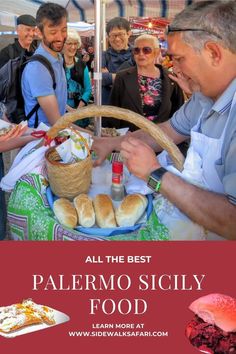 people standing around a table with food on it