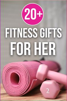 two pink dumbs with the words 20 + fitness gifts for her on top of them