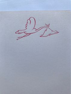 a drawing of a stork carrying a baby in it's mouth on top of a piece of paper