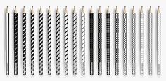 an assortment of black and white striped straws with wooden handles, lined up in rows