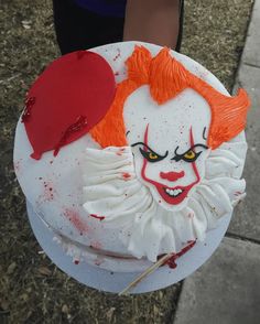 there is a cake that has been decorated to look like a clown's face