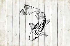 a black and white drawing of a fish on a wooden wall with planks in the background