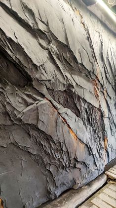 a close up of a large rock wall