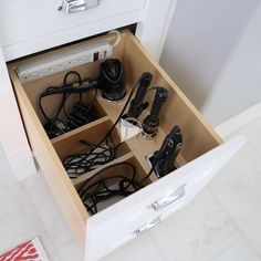 an open drawer with many different items in it