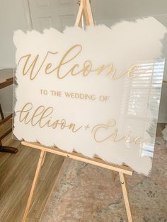 a welcome sign is displayed on an easel