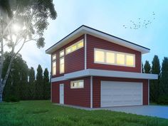 a red two story house sitting on top of a lush green field