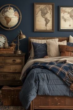 a bedroom with blue walls and pictures on the wall, bedding is made up