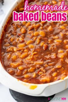 homemade baked beans in a white casserole dish with text overlay that reads homemade baked beans