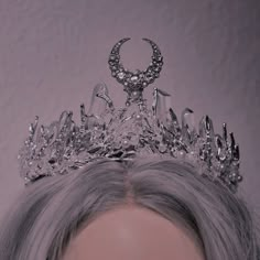 a close up of a person wearing a tiara with diamonds on it's head