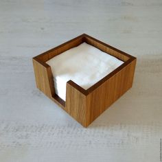 an empty napkin holder made out of wood