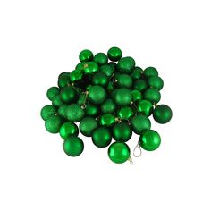 a pile of green christmas balls sitting on top of each other