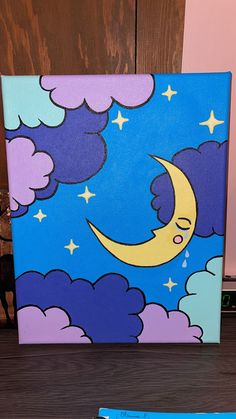 a painting of a cat sleeping on the moon with clouds and stars in the sky