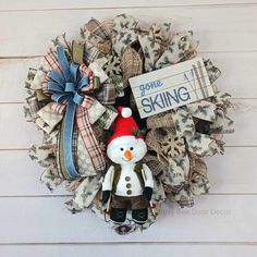 a wreath with a snowman on it