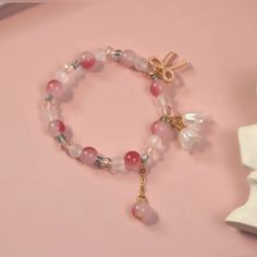 Lily Flower Bow Pendant Beaded Hand String - Sweet And Trendy Pink Gradient Jewelry Gift For Girls Elegant Flower Crystal Bracelet For Spring, Elegant Flower Shaped Crystal Bracelet For Spring, Pink Casual Beaded Bracelets For Spring, Casual Pink Crystal Bracelet With Colorful Beads, Casual Pink Beaded Crystal Bracelet, Pink Beaded Flower Crystal Bracelet, Pink Flower Crystal Bracelet With Colorful Beads, Spring Crystal Bracelet With Round Beads As Gift, Pink Flower-shaped Beaded Crystal Bracelet