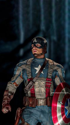 the captain is dressed up as he holds his shield in one hand and looking at something