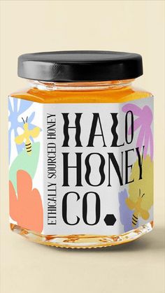 a jar of honey sitting on top of a table