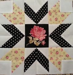 a patchwork quilt with flowers on it