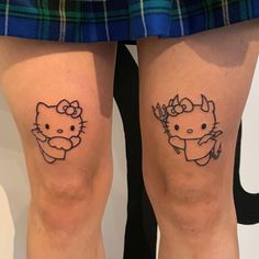 two hello kitty tattoos on both legs, one with an antelope and the other with a deer