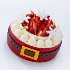 there is a red and white box with strawberries in it