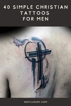 the back of a man's chest with tattoos on it and an image of a cross