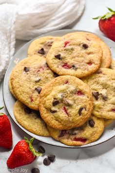 chocolate chip cookies and strawberries on a plate