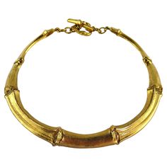 YVES SAINT LAURENT RIVE GAUCHE vintage rare gold toned bamboo design articulated collar necklace. Bamboo design T-bar and heart toggle closure. Embossed YVES SAINT LAURENT RIVE GAUCHE Made in France. Indicative measurements : max. inner measurements approx. 11.3 cm x 11.9 cm (4.45 inches x 4.69 inches) / max. width approx. 1.3 cm (0.51 inch). NOTES - This is a preloved vintage item, therefore it might have imperfections. - Colors may differ slightly from actual product appearance due to differen Luxury Recycled Gold Necklace, Bamboo Necklace, Sapphire Diamond Necklace, Bamboo Jewelry, Ysl Vintage, Vintage Ysl, Coral Bracelet, Bamboo Design, Diamond Collection