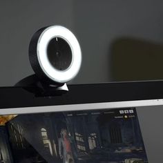 an image of a webcam that is on top of a computer screen with it's reflection in the camera lens