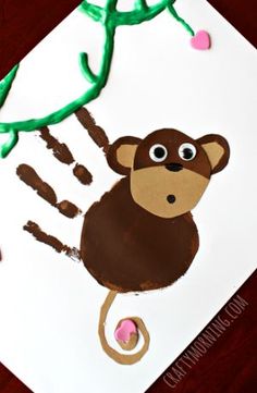 a paper plate with a monkey handprint on it