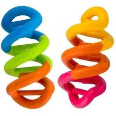 two different colored hair clips next to each other on a white background and one is in the shape of a spiral