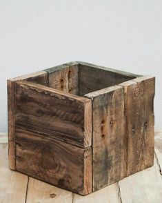 a wooden box sitting on top of a wooden table